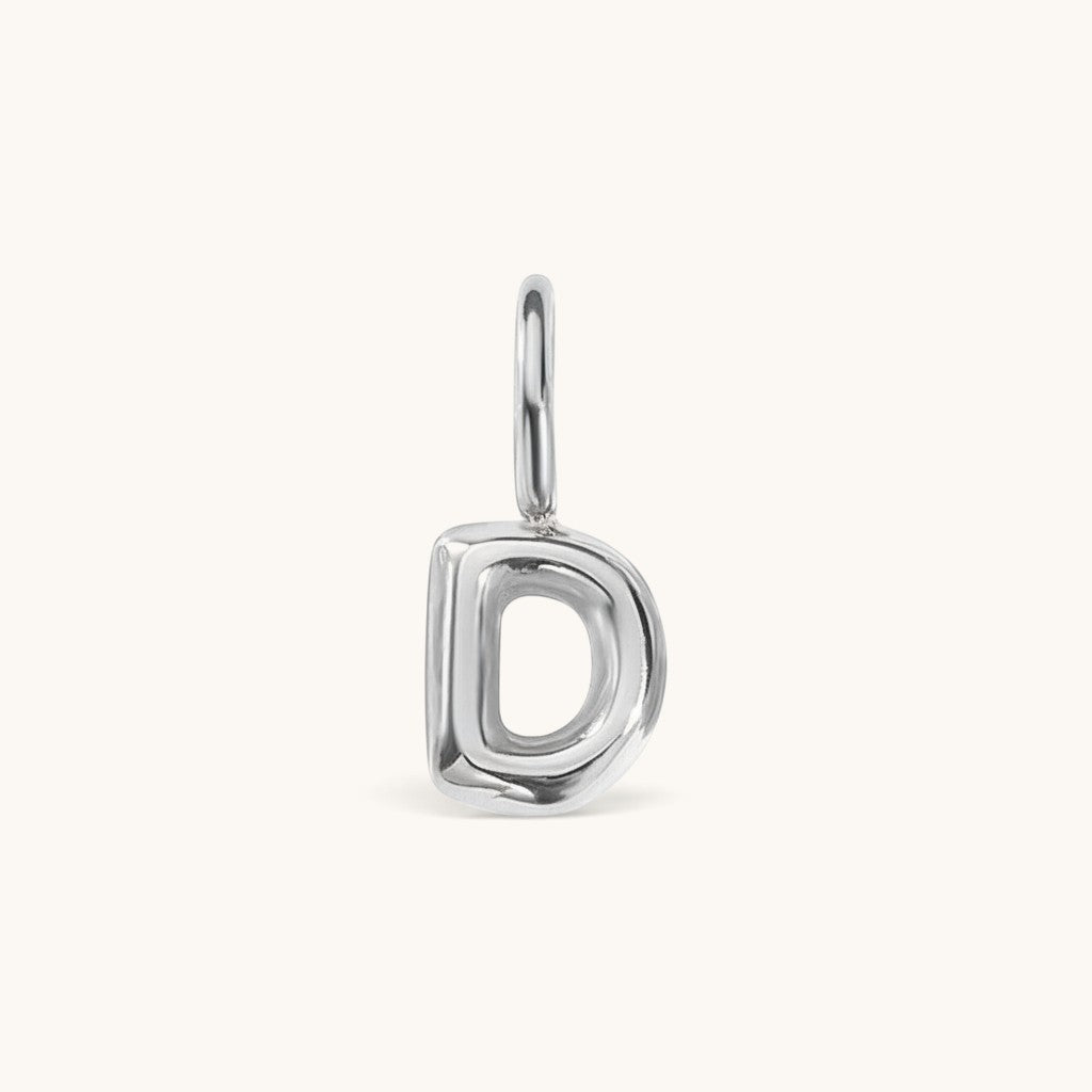 Nadare Co. silver-toned bubble initial charm in the shape of the letter D with a rounded, puffed design.