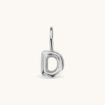 Nadare Co. silver-toned bubble initial charm in the shape of the letter D with a rounded, puffed design.