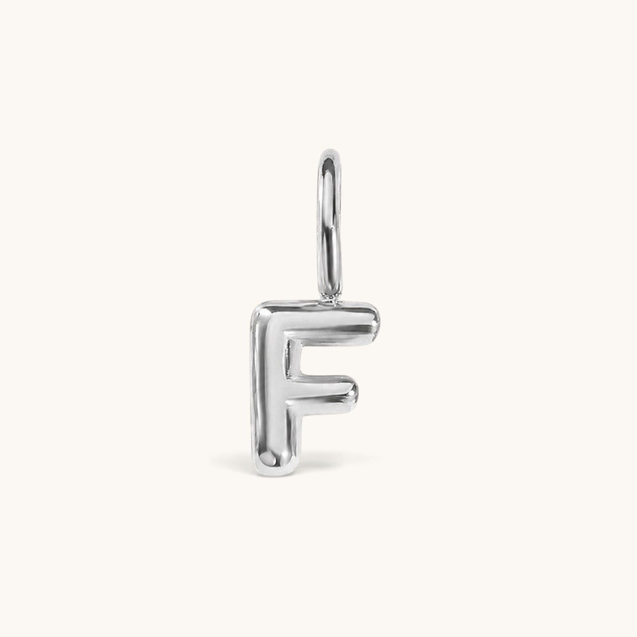 Nadare Co. silver-toned bubble initial charm in the shape of the letter F with a rounded, puffed design.