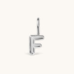 Nadare Co. silver-toned bubble initial charm in the shape of the letter F with a rounded, puffed design.