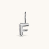 Nadare Co. silver-toned bubble initial charm in the shape of the letter F with a rounded, puffed design.