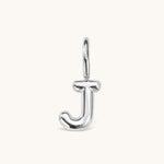 Nadare Co. silver-toned bubble initial charm in the shape of the letter J with a rounded, puffed design.