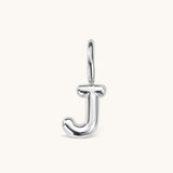 Nadare Co. silver-toned bubble initial charm in the shape of the letter J with a rounded, puffed design.