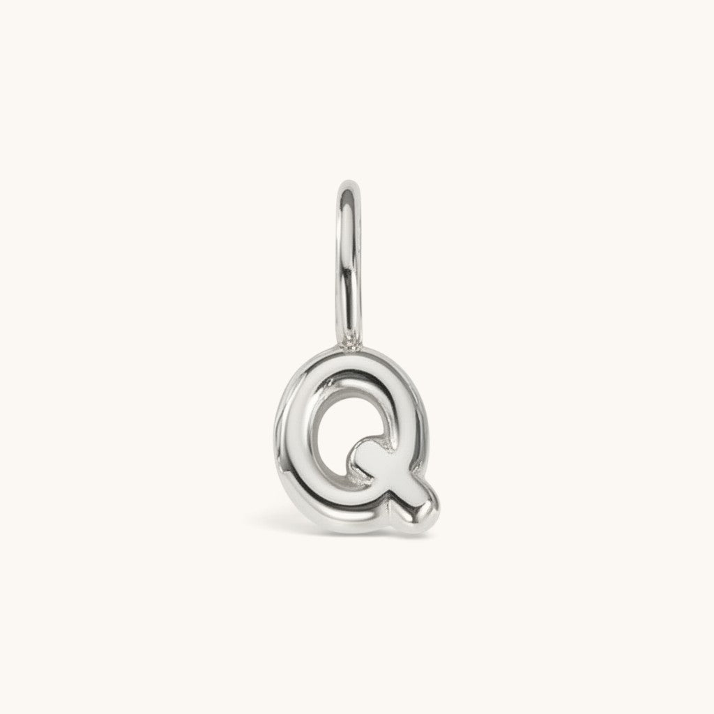 Nadare Co. silver-toned bubble letter Q charm with a rounded, puffed design for necklace layering.