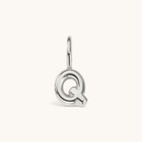 Nadare Co. silver-toned bubble letter Q charm with a rounded, puffed design for necklace layering.