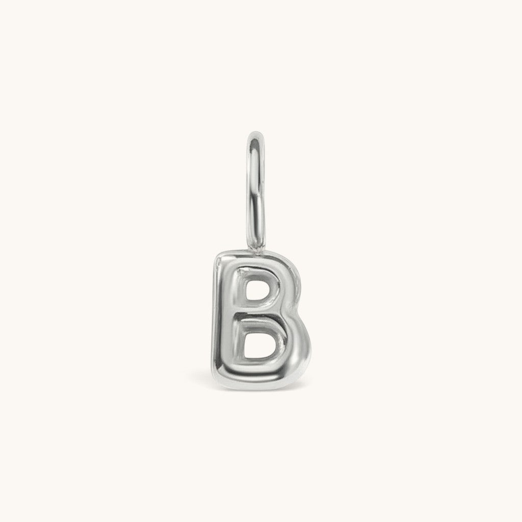 Nadare Co. silver bubble initial charm in the shape of the letter B with a rounded, puffed design.