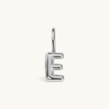 Nadare Co. silver bubble initial charm in the shape of the letter E with a puffed, rounded design.