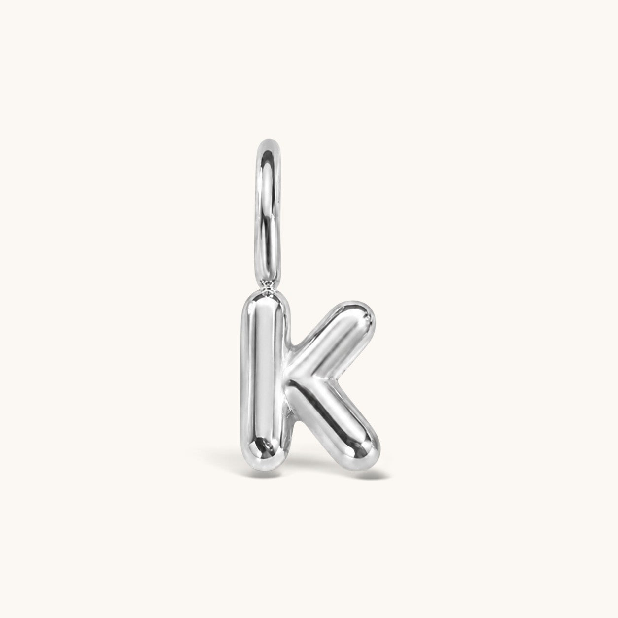 Nadare Co. silver-toned bubble initial charm in the shape of the letter K with a puffed, rounded design.