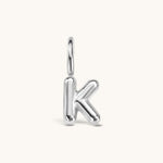Nadare Co. silver-toned bubble initial charm in the shape of the letter K with a puffed, rounded design.
