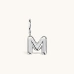 Nadare Co. silver-toned bubble initial charm in the shape of the letter M with a rounded, puffed design.