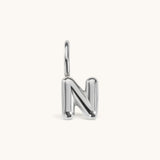 Nadare Co. silver bubble letter N charm with a rounded, puffed design for necklace layering.