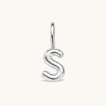 Nadare Co. silver bubble initial charm in the shape of the letter S with a rounded, puffed design.