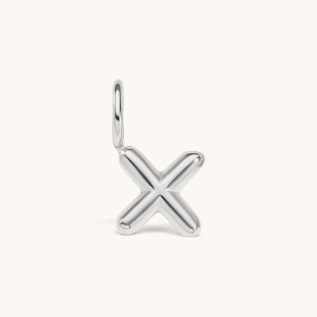 Nadare Co. silver-toned bubble letter X initial charm with a rounded, puffed design for necklace layering.