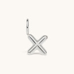 Nadare Co. silver-toned bubble letter X initial charm with a rounded, puffed design for necklace layering.