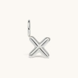 Nadare Co. silver-toned bubble letter X initial charm with a rounded, puffed design for necklace layering.