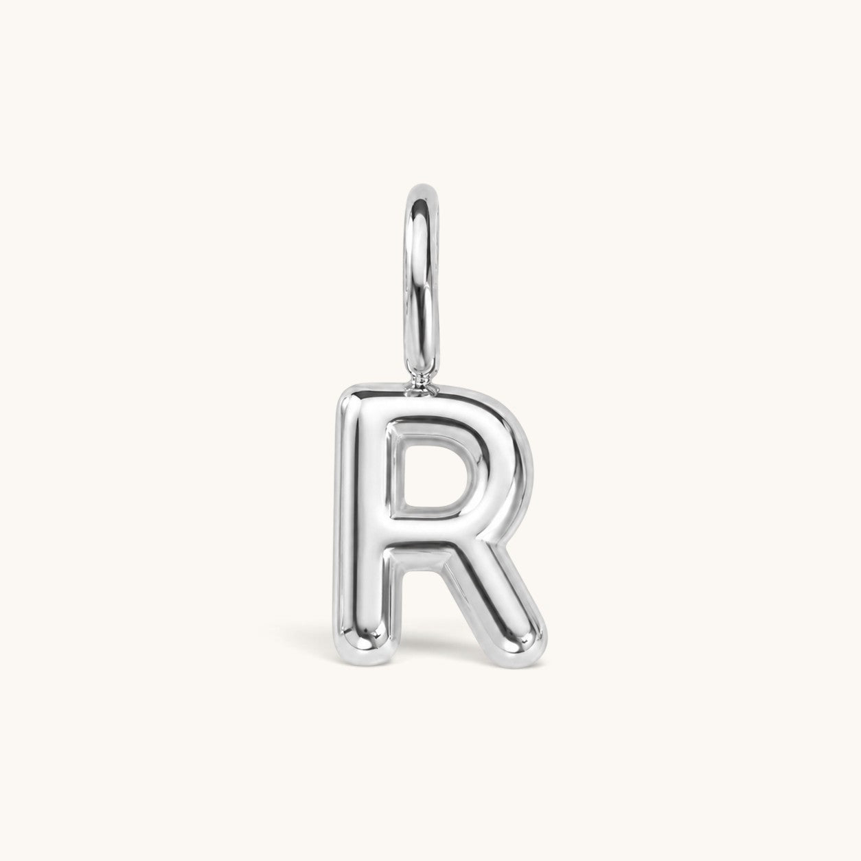 Nadare Co. silver bubble initial charm in the shape of the letter R with a rounded, puffed design.