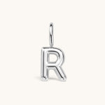 Nadare Co. silver bubble initial charm in the shape of the letter R with a rounded, puffed design.