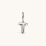 Nadare Co. silver-toned bubble initial charm in the shape of the letter T with a smooth, puffed design.