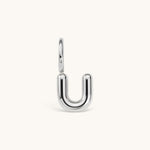 Nadare Co. silver-toned bubble initial charm in the shape of the letter U with a rounded, puffed design.