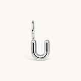 Nadare Co. silver-toned bubble initial charm in the shape of the letter U with a rounded, puffed design.