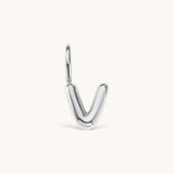 Nadare Co. silver-toned bubble initial charm in the shape of the letter V, featuring a playful puffed design.