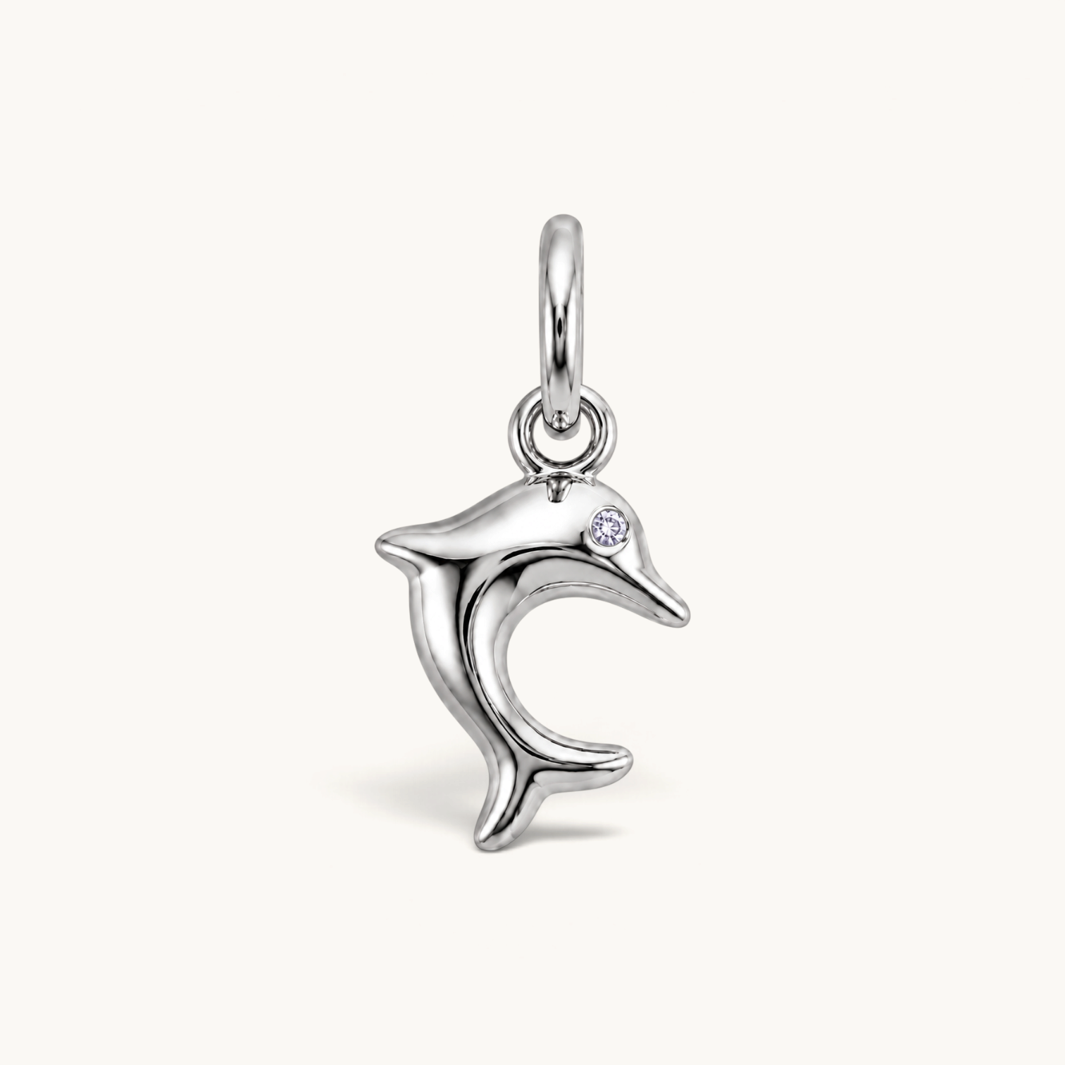 Nadare Co. silver-toned dolphin charm with a sparkling cubic zirconia eye, featuring a sleek leaping silhouette.