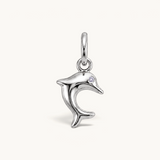 Nadare Co. silver-toned dolphin charm with a sparkling cubic zirconia eye, featuring a sleek leaping silhouette.