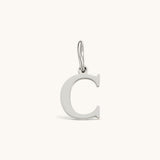Nadare Co. silver-toned initial charm featuring a clean serif letter C for personalized jewelry layering.