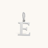 Nadare Co. silver-toned stainless steel initial E charm with a clean serif font for everyday jewelry layering.