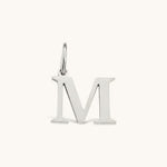 Nadare Co. silver-tone stainless steel letter M initial charm with a classic serif font design.