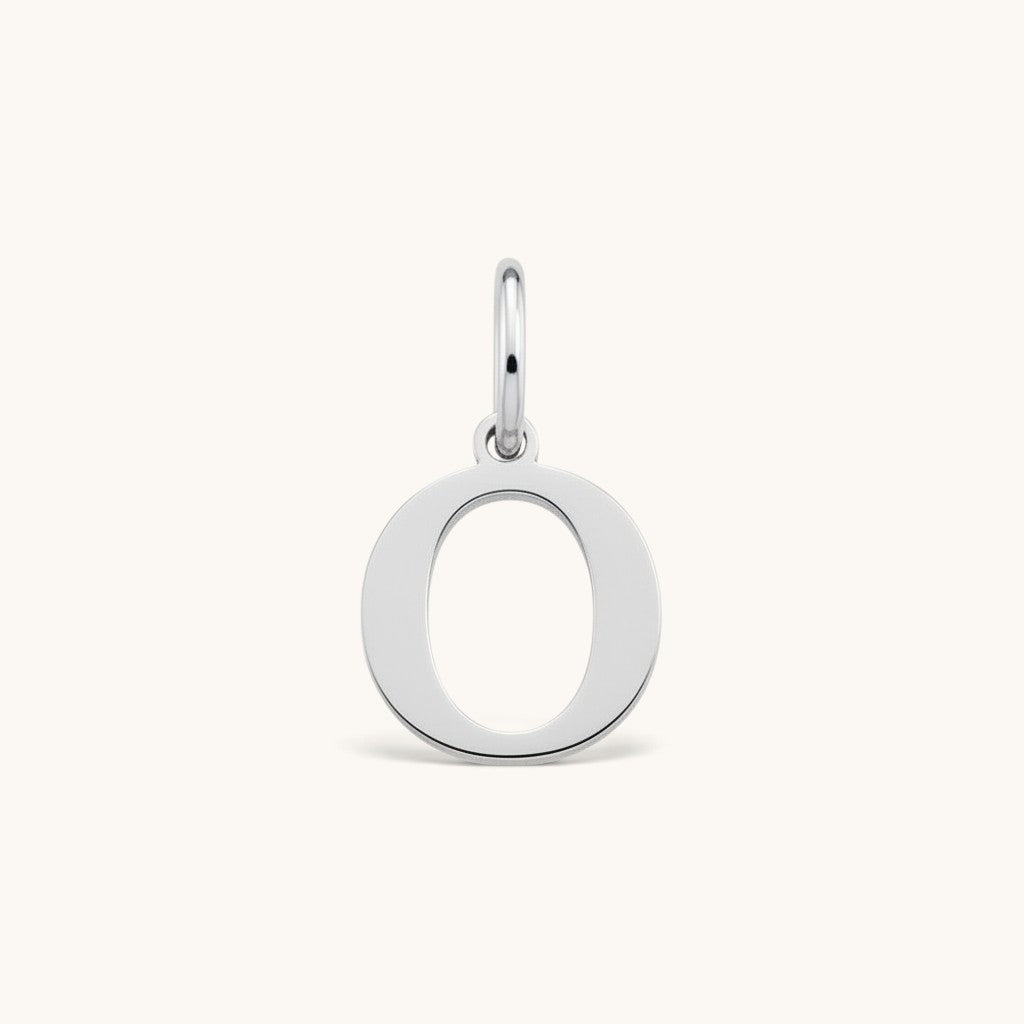 Nadare Co. silver-toned stainless steel initial charm featuring a clean serif letter O on a small jump ring.