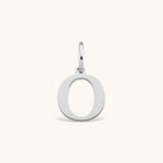 Nadare Co. silver-toned stainless steel initial charm featuring a clean serif letter O on a small jump ring.