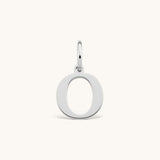 Nadare Co. silver-toned stainless steel initial charm featuring a clean serif letter O on a small jump ring.