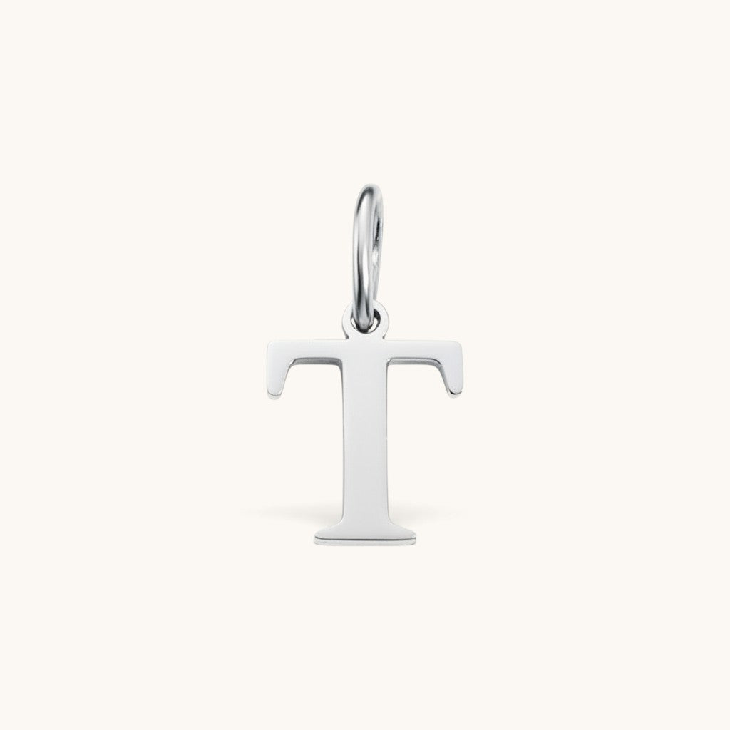 Nadare Co. silver-toned letter T initial charm with a clean serif font design for necklace layering.