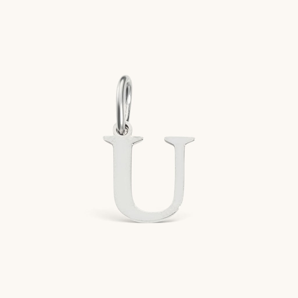 Nadare Co. silver-tone stainless steel letter U initial charm with a classic serif font design.