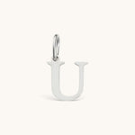 Nadare Co. silver-tone stainless steel letter U initial charm with a classic serif font design.