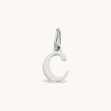Nadare Co. silver-tone lowercase letter C charm made from durable stainless steel for everyday jewelry layering.