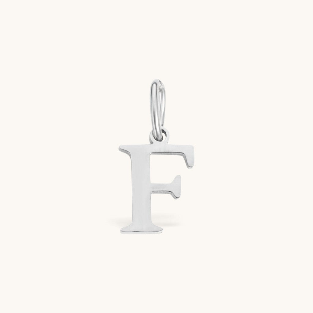 Nadare Co. silver-toned stainless steel letter F initial charm with a classic serif font design.