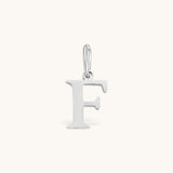 Nadare Co. silver-toned stainless steel letter F initial charm with a classic serif font design.