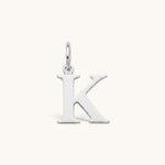 Nadare Co. silver-tone stainless steel initial K charm with a polished serif letter design