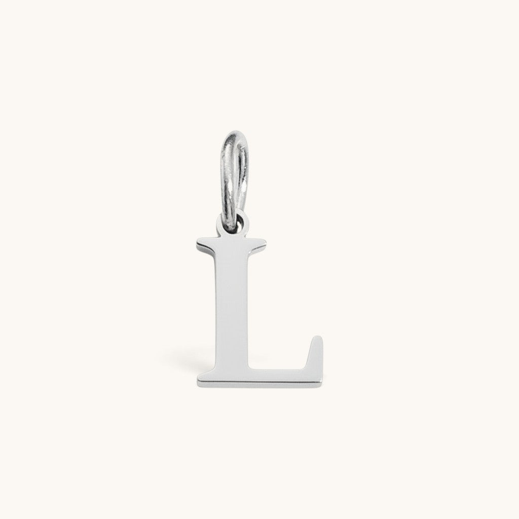 Nadare Co. silver-toned stainless steel initial L charm with a classic serif font design.