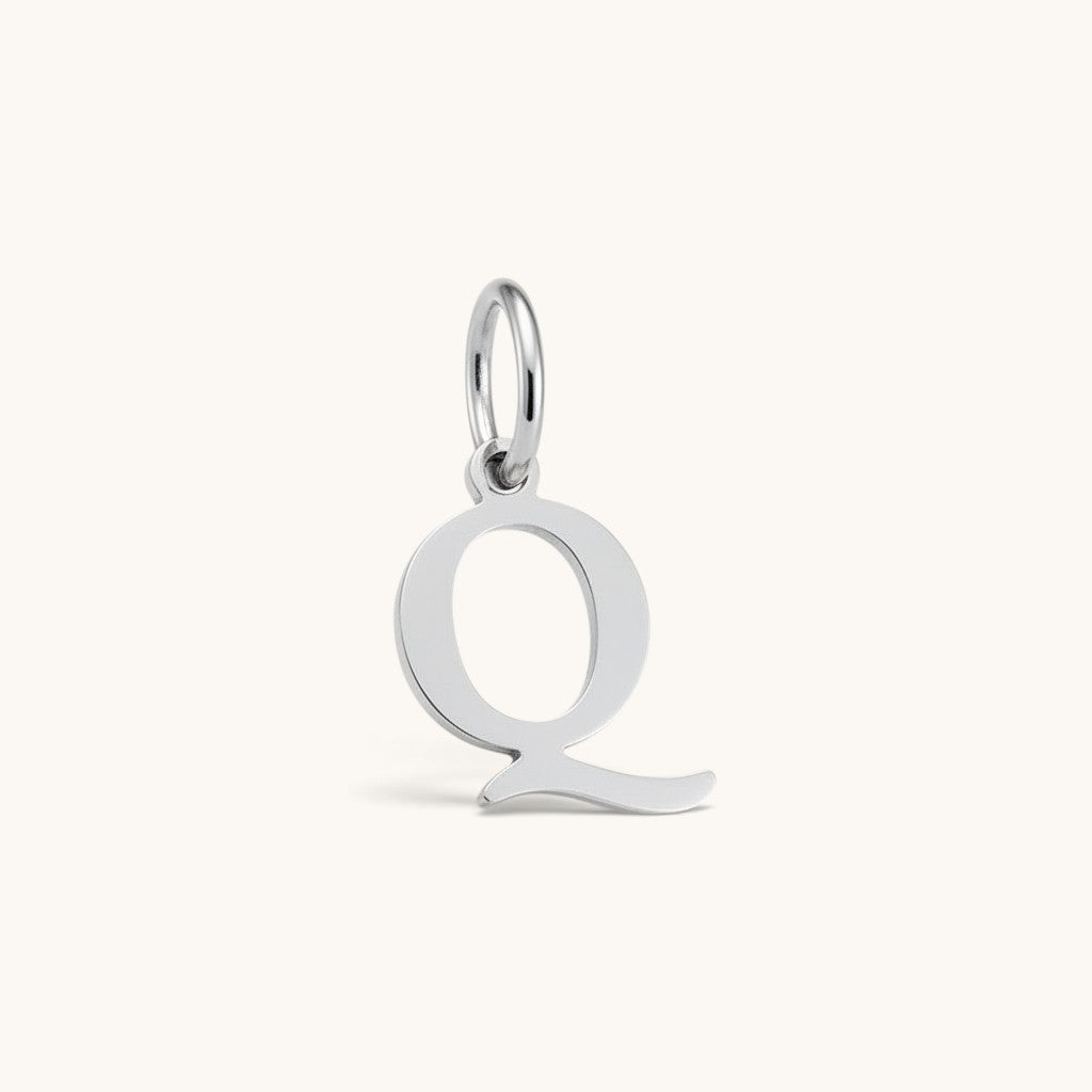 Nadare Co. silver-toned letter Q initial charm with a clean serif font design for everyday jewelry layering.