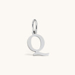 Nadare Co. silver-toned letter Q initial charm with a clean serif font design for everyday jewelry layering.