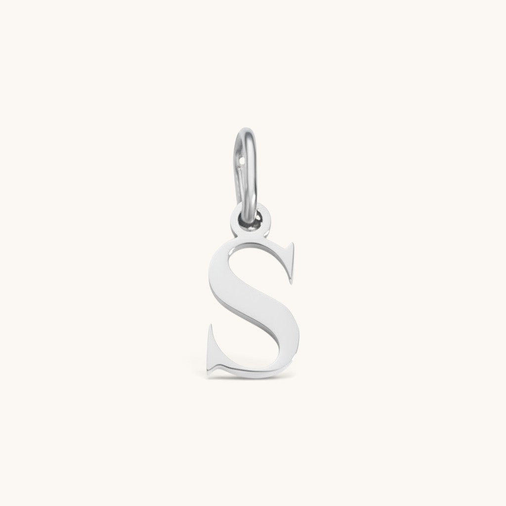 Nadare Co. silver-tone stainless steel lowercase letter S charm for everyday jewelry layering.