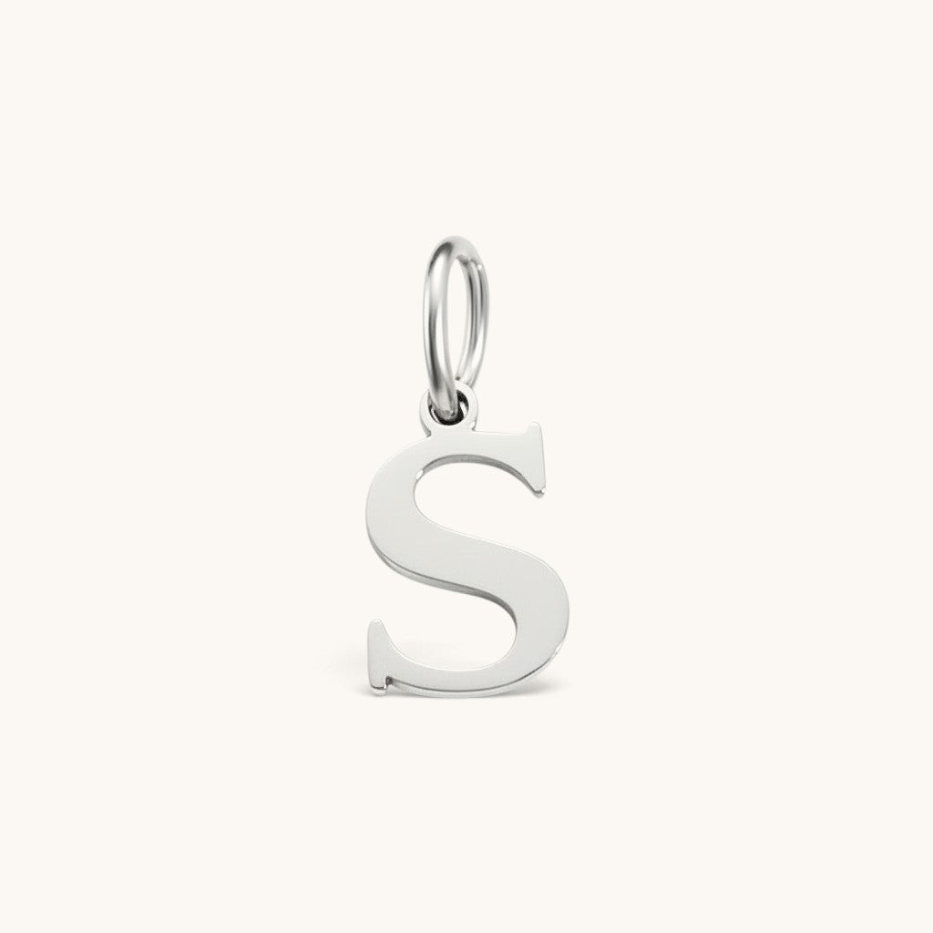 Nadare Co. silver-toned stainless steel letter S initial charm with a classic serif font design.
