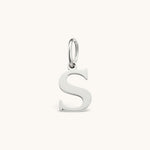 Nadare Co. silver-toned stainless steel letter S initial charm with a classic serif font design.