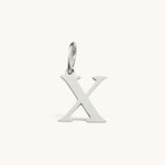 Nadare Co. silver-toned stainless steel letter X charm with a polished serif font design for necklace layering.