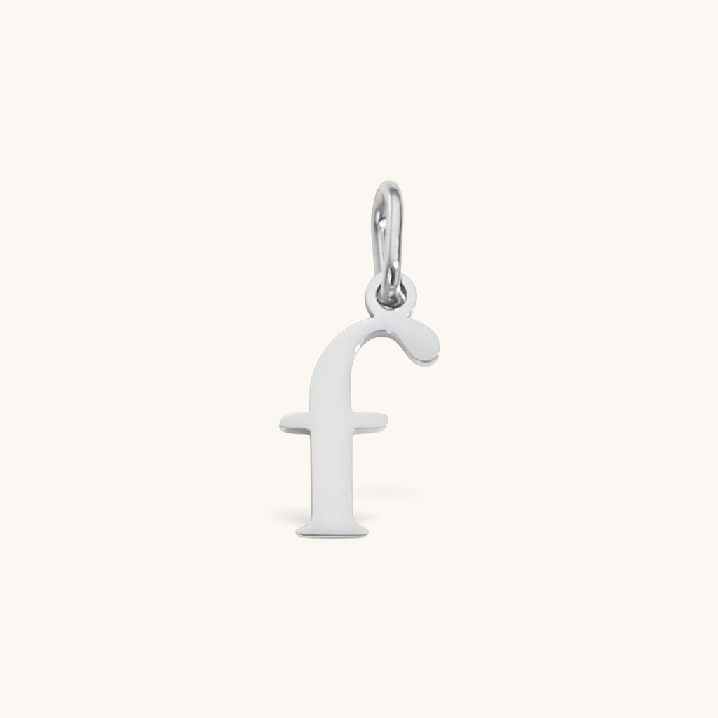 Nadare Co. silver-toned lowercase letter f charm made from stainless steel for everyday jewelry layering.