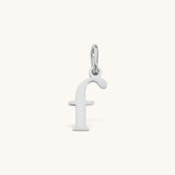 Nadare Co. silver-toned lowercase letter f charm made from stainless steel for everyday jewelry layering.