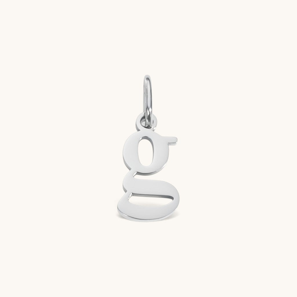 Nadare Co. silver lowercase letter g charm made from durable stainless steel for everyday jewelry layering